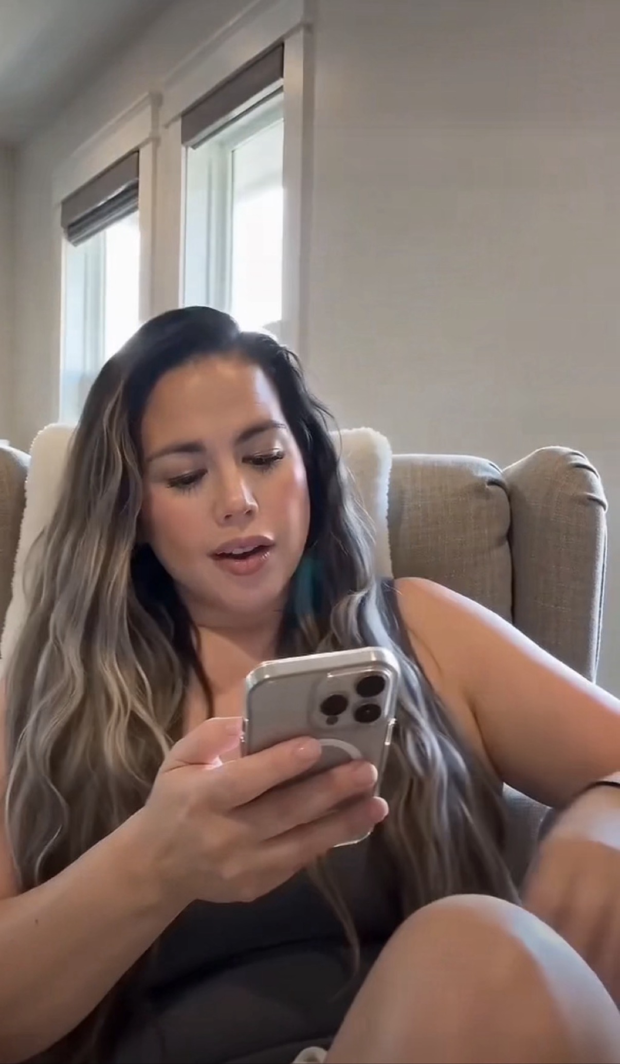 Fatima filming content at home with her phone