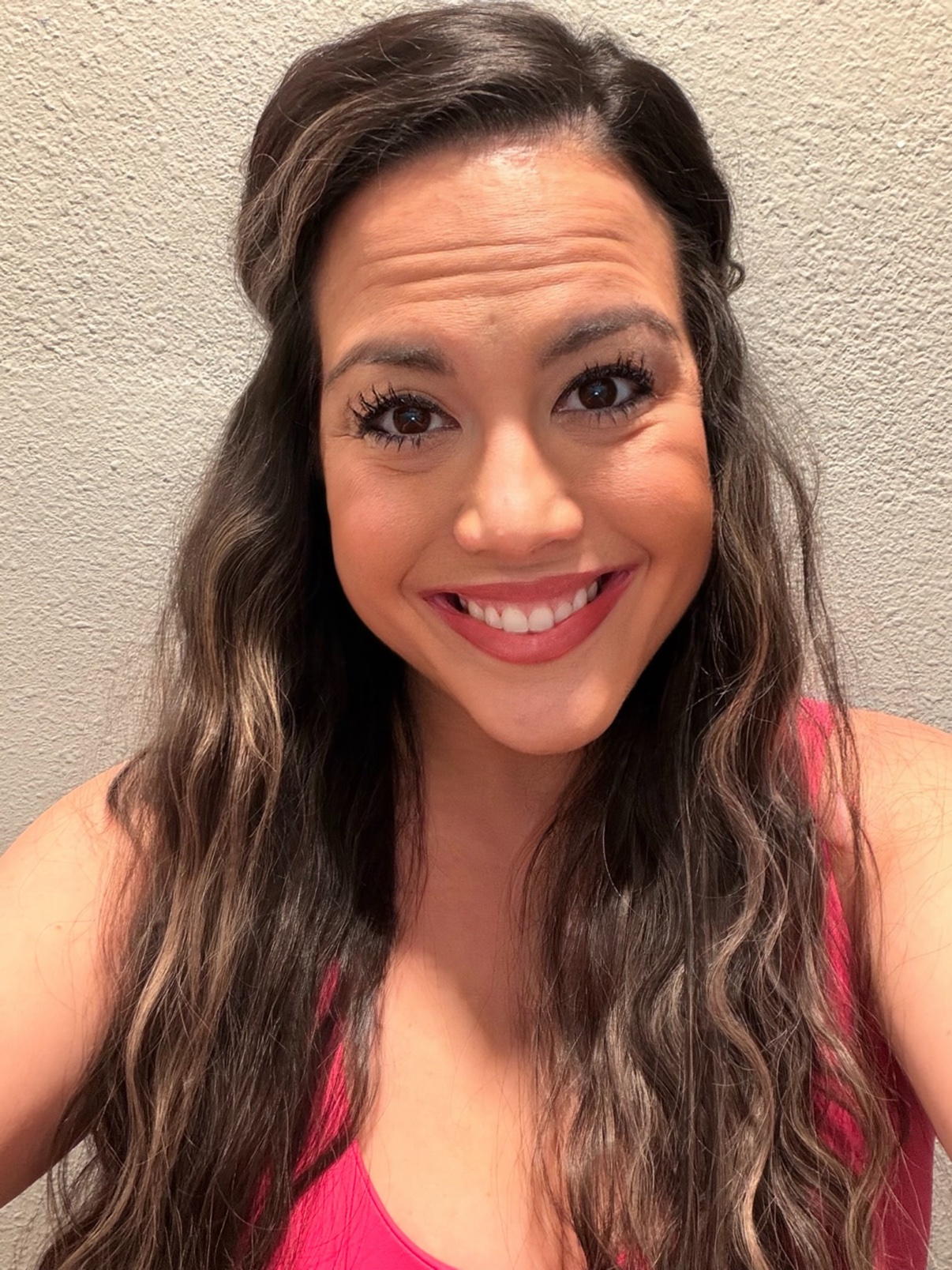 Fatima Carrillo smiling in a bright pink top